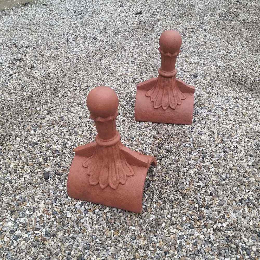 Adding a custom touch to your roof with terracotta brown ball top roof finials